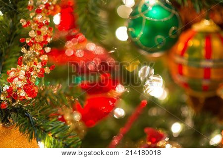 Christmas Background With Glittery And Tree Leaves In Focus On Side