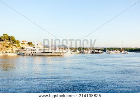 Luxury Yachts and boats parked in harbour, marina, in the morning at sunset, harbor of Sibenik, Croatia