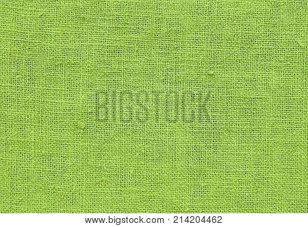 Textile Texture Close Up of Green Chartreuse Sack or Burlap Fabric Pattern Background with Copy Space for Text Decoration.