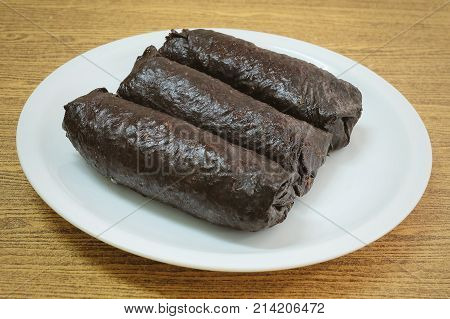 Japanese Cuisine Traditional Unsliced Japanese Rice Maki Sushi Roll with Nori Seaweed.