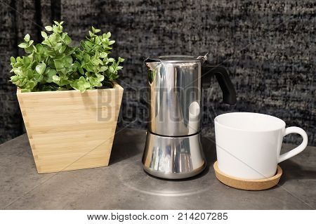 Cuisine and Food Two White Porcelain Cup and Coffee Pot with Artificial Plant on The Table Used for Preparing and Drinking Coffee in The Morning.