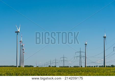Wind power plants and power transmission lines seen in rural Germany