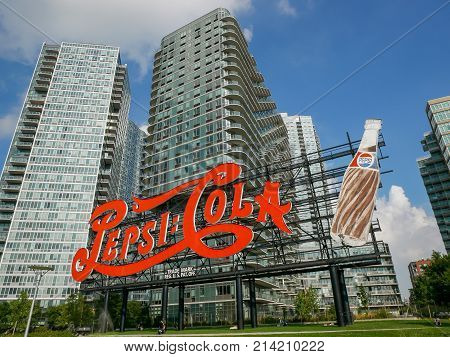 NEW YORK - SEP 2017: Landmark of classic Pepsi-Cola Sign and modern apartment buildings in Quinees New York City