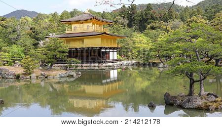 Scenic landscape of famous landmark and Unesco site of Kyoto, Kinkakuji or Rokuonji. The Golden Pavilion, whose top two floors are completely covered in gold leaf, is a Zen temple of Rinzai sect.