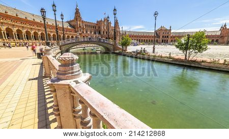 Daily scene at Plaza de Espana. River with river and tourists