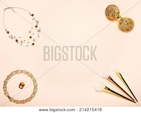 Fashionable Women's Cosmetics and Accessories. Falt Lay. Stylish Sunglass. Make-Up Brushes. Gold Necklace. Women Accessories
