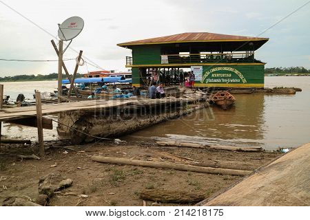 Wooden Canoe In River Port