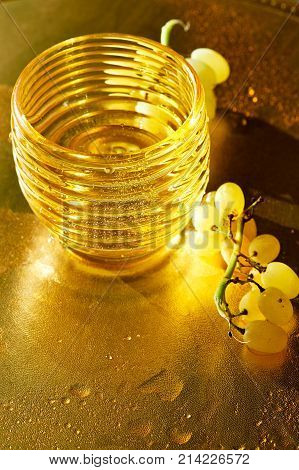Golden texture. Konzerte wealth, fullness and freshness. Water and grapes