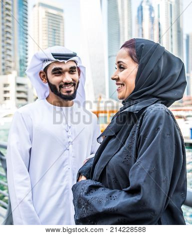 Arabic couple with traditional clothes dating outdoors