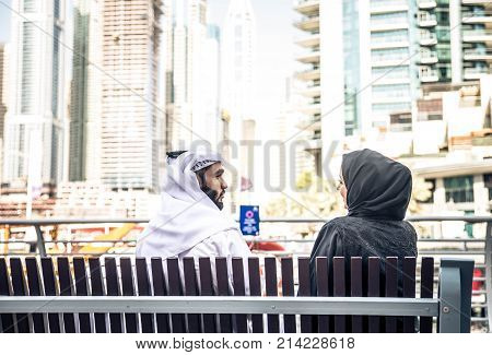 Arabic couple with traditional clothes dating outdoors