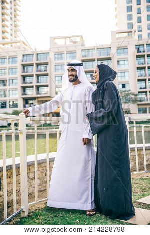 Arabic couple with traditional clothes dating outdoors