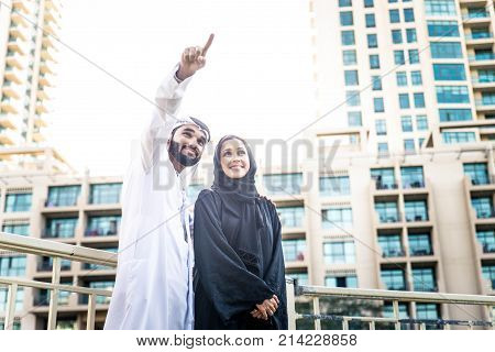 Arabic couple with traditional clothes dating outdoors