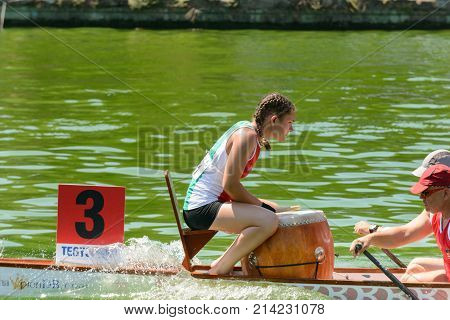 Rome Italy - July 30 2016: Dragon boat crews compete at the european championships held in Italy in 2016 summer Hungary crew the girl giving time and beat