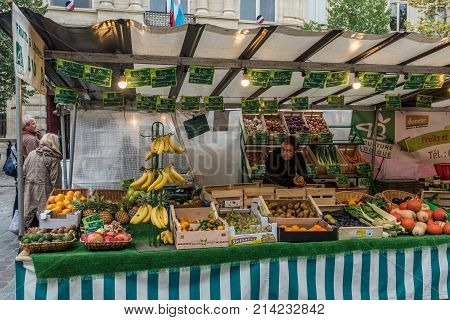 Paris France -- November 4 2017 -- Food stand at a Parisan farmers market in Autumn. Editorial Use Only.