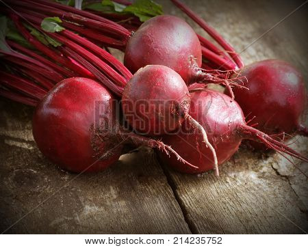 Fresh beetroot on rustic wooden background. Harvest vegetable cooking conception . Diet or vegetarian food concept .