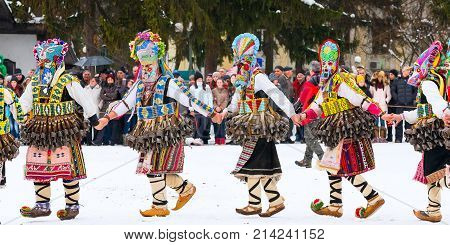Razlog, Bulgaria - January 14, 2017: People in traditional carnival kuker costumes at Kukeri festival Starchevata