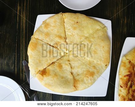 Traditional Georgian pie - khachapuri is a cake baked in the oven with cheese