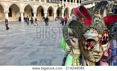 Doge's Palace and famous venetion masks at San Marco square, Venice, Italy