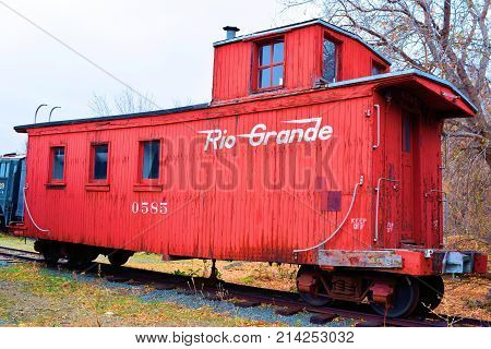 November 6, 2017 in Golden, CO:  Rio Grande caboose on display on this stockyard at the Colorado Railroad Museum in Golden, CO where people can visit this museum daily and see rail cars and locomotives upfront and personal