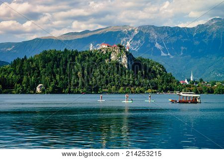 Colorful summer scene on the Bled lake with medieval castle Blejski grad. Slovenia, Europe.