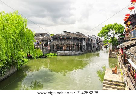 August 8 2015. Xitang Town China. Chinese style buildings and tourist boats on the water canals of Xitang town in Jiashan county in Zhejiang province China.