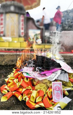 Chinese Taoism Tradition Burn Paper Money And Gold To Ancestors