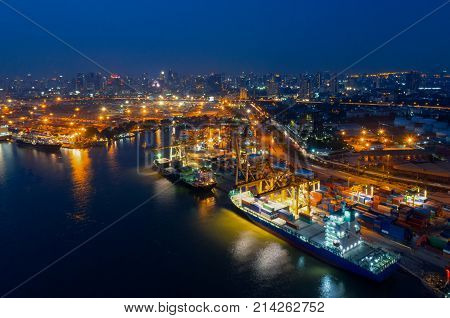 Containers yard in port congestion with ship vessels are loading and discharging operations of the transhipments in international port.