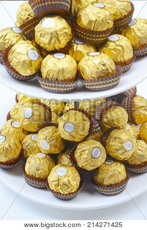 BANGKOK THAILAND - November 15, 2017: A box of Ferrero Rocher Chocolates. Since 1982, the candy consists of a whole roasted hazelnut in a thin wafer shell filled with hazelnut cream coated in milk