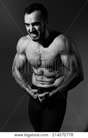 Muscular Screaming Man With A Naked Torso.