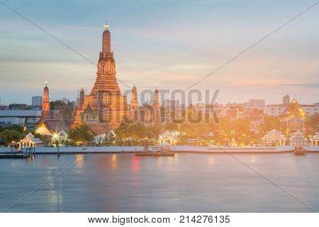 Arun buddish temple river front after sunset Bangkok landmark