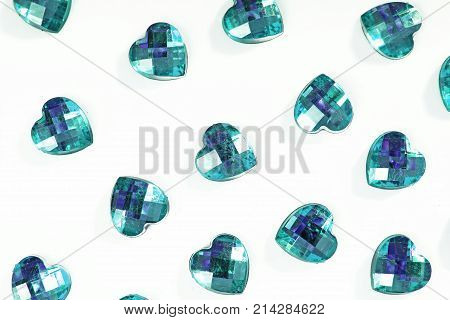 Rhinestone background. Heart shape texture as backdrop isolated white studio photo. Bling rhinestone crystal pattern. Rhinestones crystals as background. Rhinestiones.