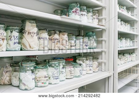 MOSCOW RUSSIA - June 24 2009. Glass jars with rags inside - samples of human blood and sweat. Shelves with material evidences in laboratory of examination human olfactory traces.