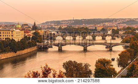 Old bridges of Prague at sunset from Letna park.