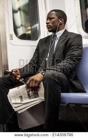 Businessman in full suit in New York subway metro
