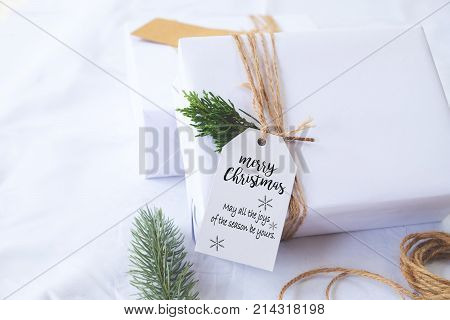 Christmas background - Craft and handmade Christmas present (gift boxes) with tag. Vintage style. Selective focus and shallow.