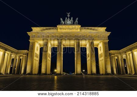 Brandenburg gate at night Berlin Germany Europe. Beautiful german architecture. Brandenburger Tor with night illumination. Popular landmark in centre of Berlin. Famous travel destination of Germany