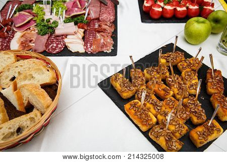 cheese sticks. Food tray with delicious salami pieces of sliced ham sausage salad. Bread. Tomatoes stuffed with cheese and garlic - Meat platter with selection. Snacks. buffet table. restaurant feed. New Year Christmas
