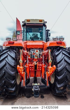 Rear view of modern agricultural tractor. Hydraulic hitch. Lifting frame. Rear mechanism for attaching trailed equipment.
