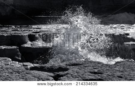 Huge wave explosion close up HDR effect, big wave, storm in the sea, stormy day and big waves in the sea, water sparks,Malta, storm in Malta.Black and white photo. Amazing waves in St Peter pool,Malta
