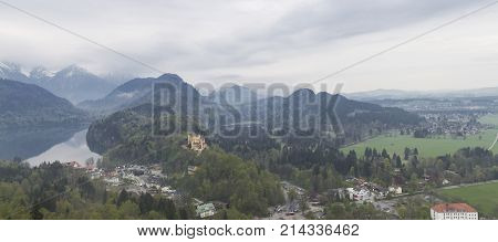 Beautiful view of the Hohenschwangau Castle and the Alpsee lake from the Neuschwanstein castle located near the city of Füssen, Munich