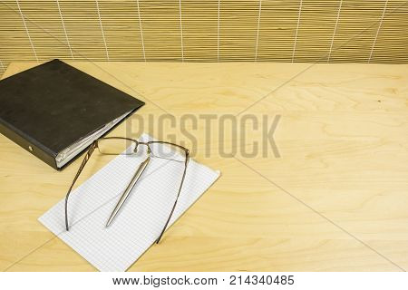 Notes And Pen On The Desk.