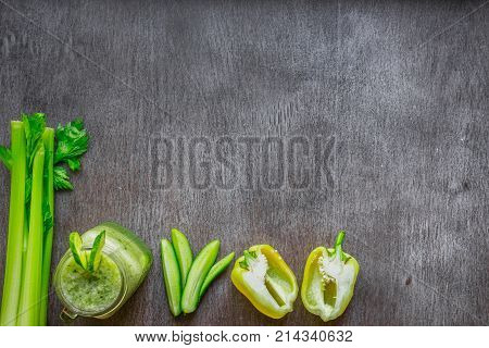 Green vegetable smoothie with celery and cucumber. Top view. Copy space. Still life. Flat lay.