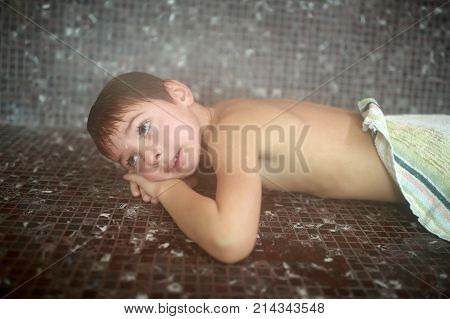 Child Lying In Hammam