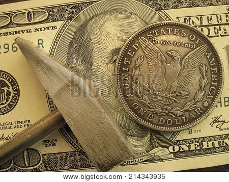 Symbol of economy and finance to get profit and income. Hammer to forge or to mine coins and bills. 