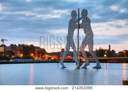 BERLIN - AUGUST 22 2017: Molecul Man sculpture on August 22 2017 in Berlin Germany. It's one in a series of aluminium sculptures designed by American artist Jonathan Borofsky installed at various locations in the world including Berlin.