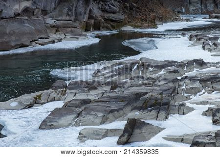 Winter mountain landscape with river and forest Prut river in Carpathians Ukraine Yaremche