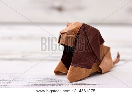 Origami lion 3D model. Folding paper into wonderful animal figurine. Zoo, children's art project idea.