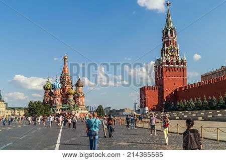 MOSCOW RUSSIA - July 23 2014: Tourists walking on the Red Square near the Kremlin beautiful sunny day.