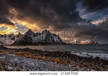 Dramatic nature. Taken at Vareide in Flakstad, lofoten islands showing part of the Flakstad island with mt.Stortinden and mt flakstadtind in the rear.