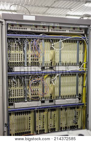 Network server room with hardware computers for digital tv ip and network internet communications, vertical photo